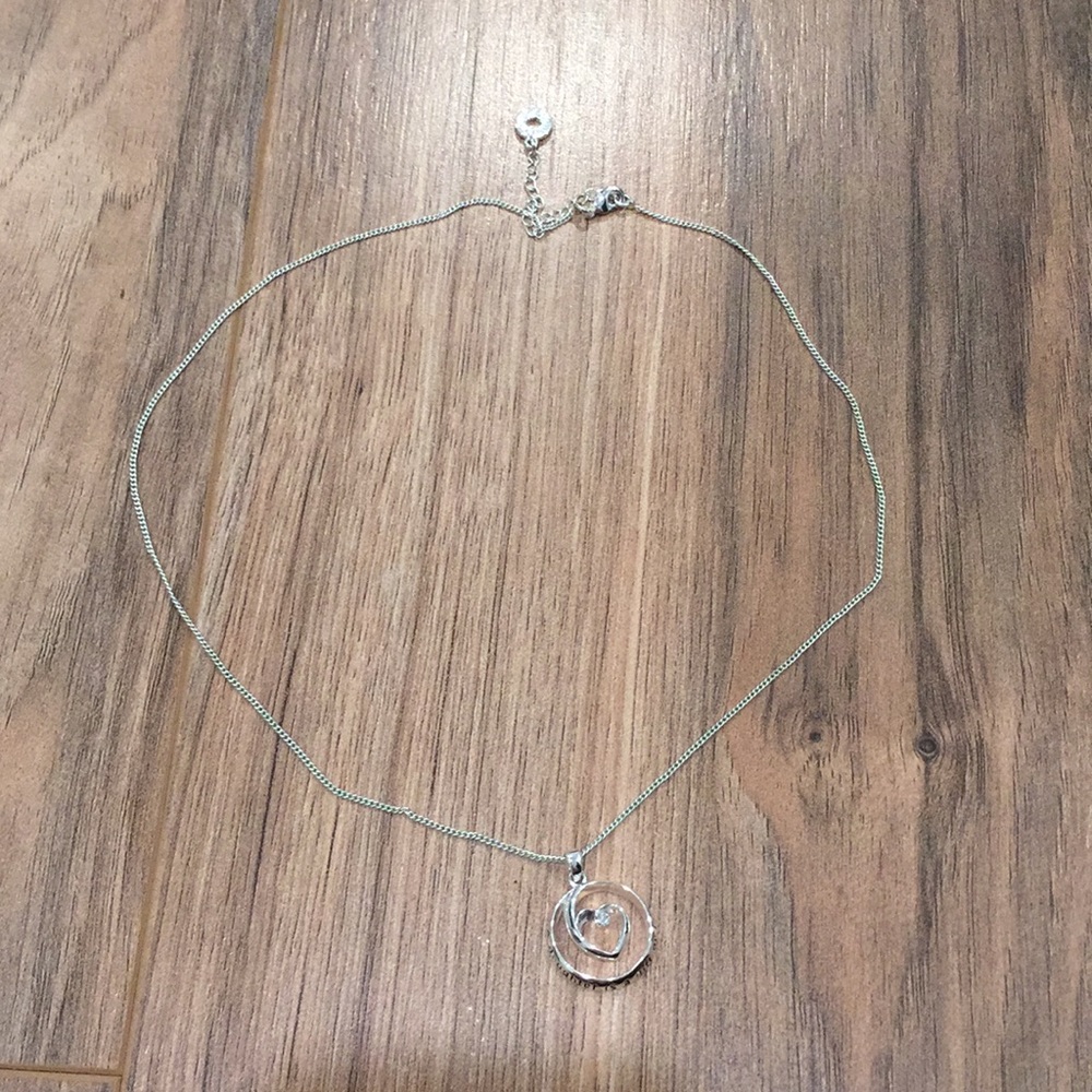 Sliver heart swirl necklace. Never worn.